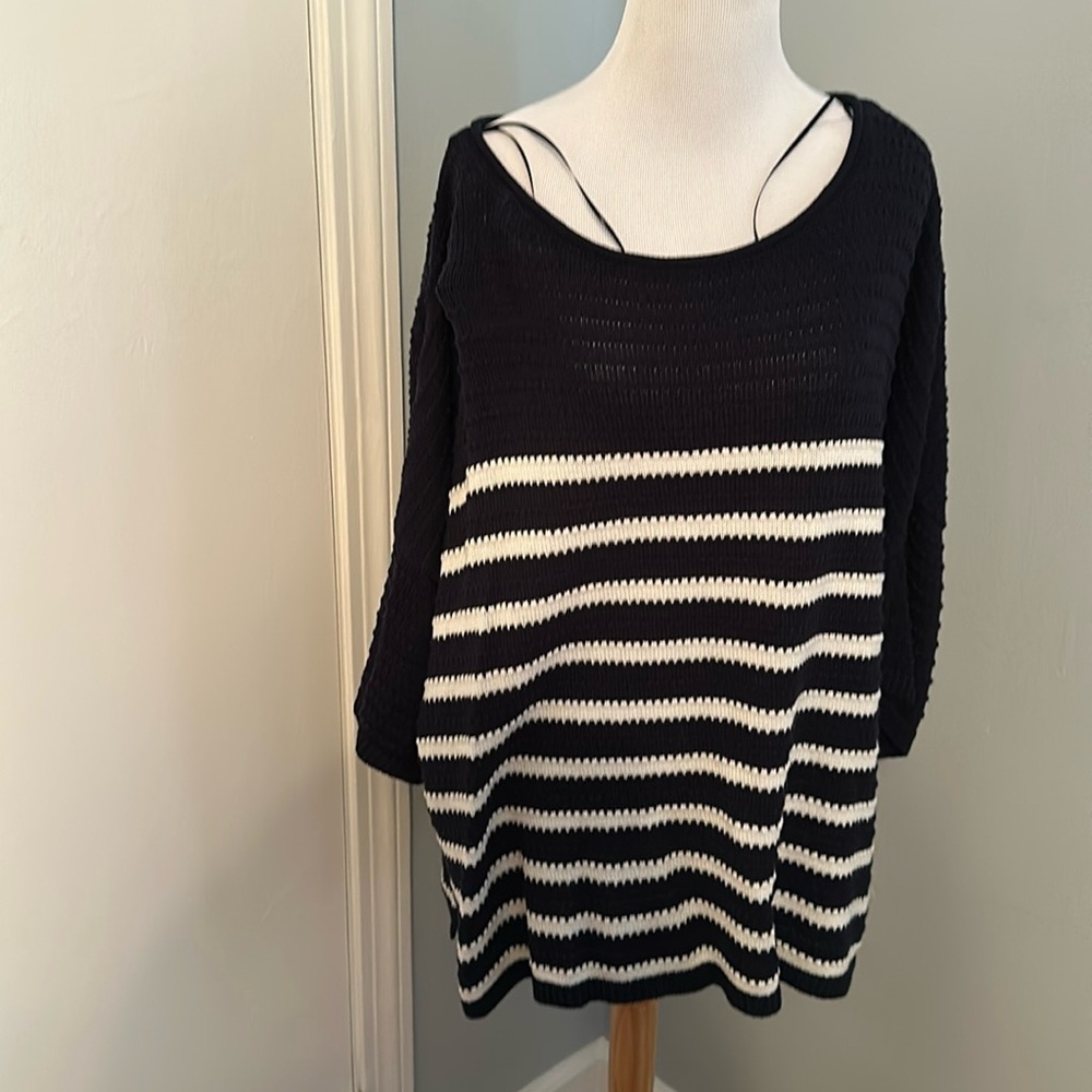Blue sweater with white stripes. Knitted.